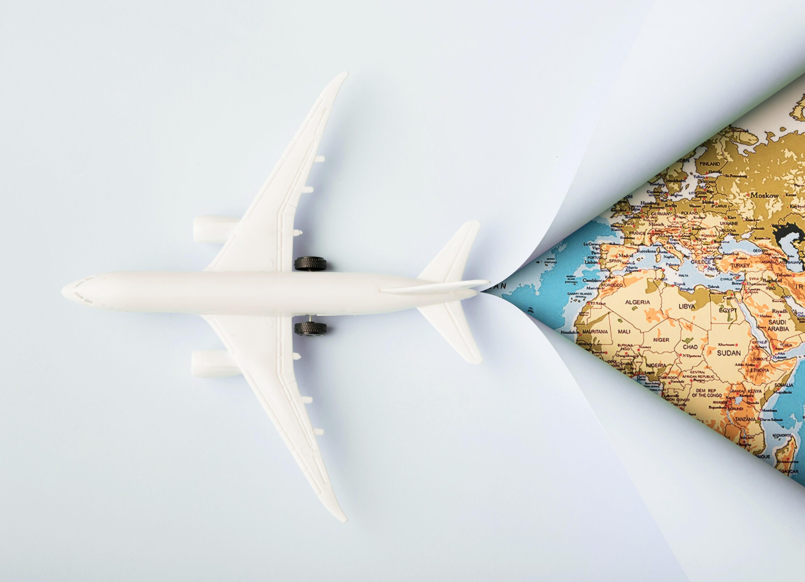 top-view-white-toy-plane-map